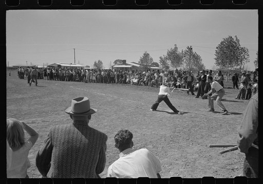 Baseball game at the annual field day at the FSA (Farm Security Administration) farmworkers community. Yuma, Arizona