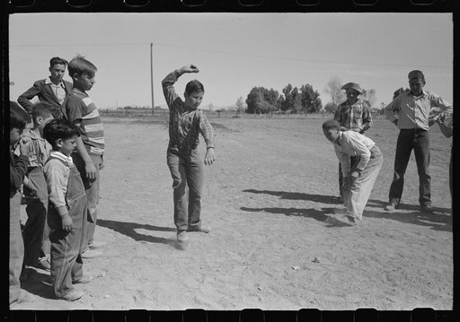Top spinning contest at the annual field day of the FSA (Farm Security Administration) farmworkers community, Yuma, Arizona