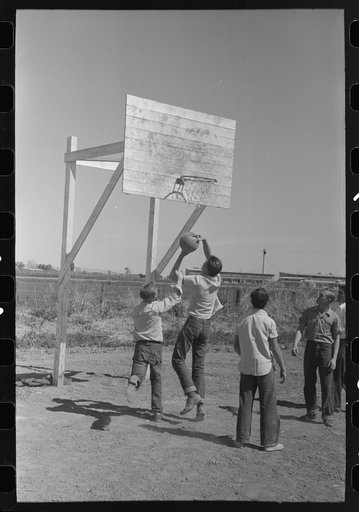 Basketball game at the annual field day of the FSA (Farm Security Administration) farmworkers community, Yuma, Arizona
