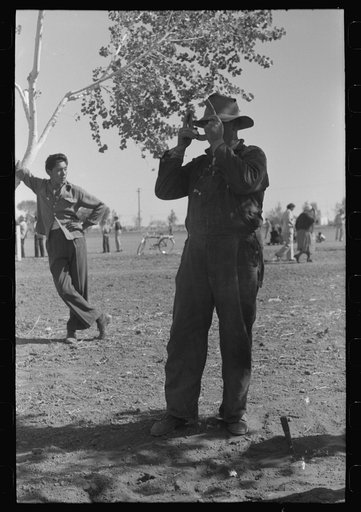 Untitled photo, possibly related to: Horseshoe pitching contest at the annual field day of the FSA (Farm Security Administration) farmworkers community, Yuma, Arizona