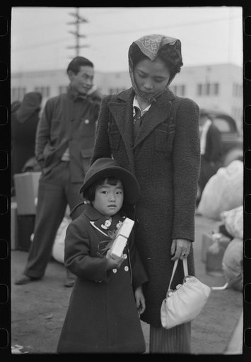 Los Angeles, California. The evacuation of the Japanese-Americans from West Coast areas under U.S. Army war emergency order. Waiting at the old Santa Fe station for the train which will take them to Owens Valley