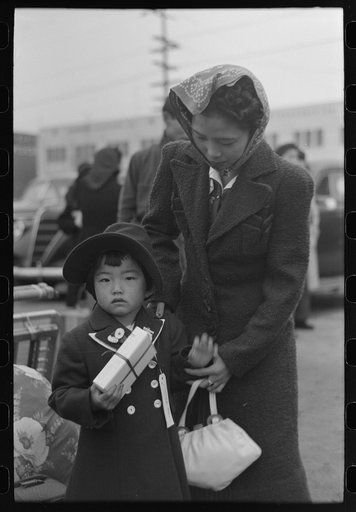 Untitled photo, possibly related to: Los Angeles, California. The evacuation of the Japanese-Americans from West Coast areas under U.S. Army war emergency order. Waiting at the old Santa Fe station for the train which will take them to Owens Valley