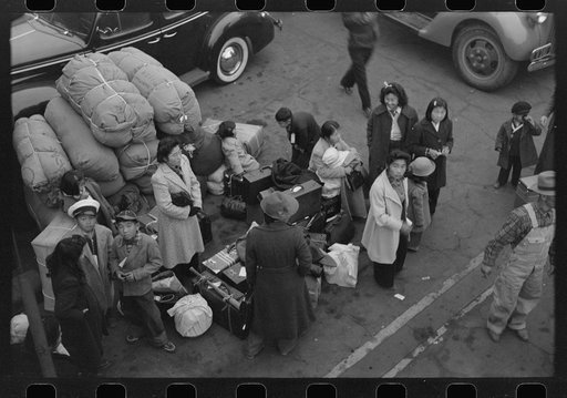 Los Angeles, California. The evacuation of the Japanese-Americans from West Coast areas under U.S. Army war emergency order. Waiting with their baggage for trains which will take them to Owens Valley