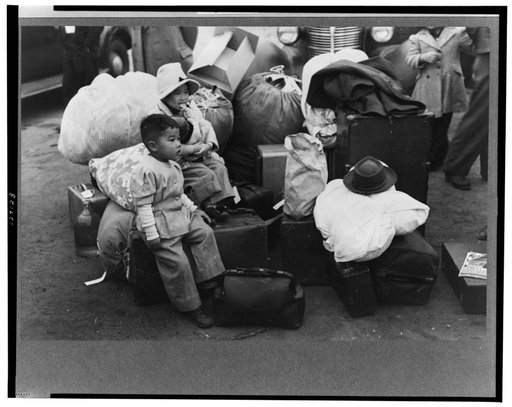 Los Angeles, California. The evacuation of the Japanese-Americans from West Coast areas under U.S. Army war emergency order. Japanese-Americans waiting for a train to take them and their parents to Owens Valley