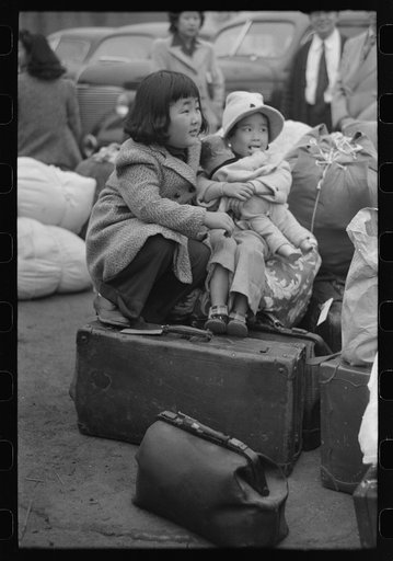 Los Angeles, California. The evacuation of the Japanese-Americans from West Coast areas under U.S. Army war emergency order. Japanese-American children waiting for a train to take them and their parents to Owens Valley