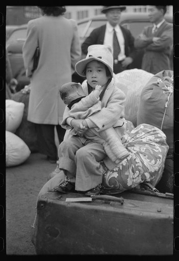 Los Angeles, California. The evacuation of the Japanese-Americans from West Coast areas under U.S. Army war emergency order. Japanese-American children waiting for a train to take them and their parents to Owens Valley