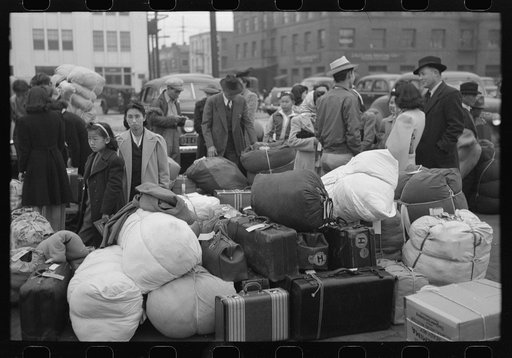 Los Angeles, California. The evacuation of the Japanese-Americans from West Coast areas under U.S. Army war emergency order. They are waiting with their luggage at the old Santa Fe station for a train which will take them to Owens Valley