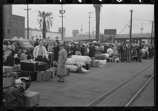 Los Angeles, California. The evacuation of the Japanese-Americans from West Coast areas under U.S. Army war emergency order. Waiting with their luggage at the old Santa Fe station for a train to take them to Owens Valley