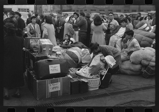 Los Angeles, California. The evacuation of the Japanese-Americans from West Coast areas under U.S. Army war emergency order. Evacuees waiting with their luggage at the old Santa Fe station for a train to take them to Owens Valley