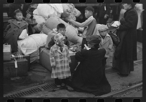 Los Angeles, California. The evacuation of the Japanese-Americans from West Coast areas under U.S. Army war emergency order. Evacuees waiting with their luggage at the old Santa Fe station for a train to take them to Owens Valley