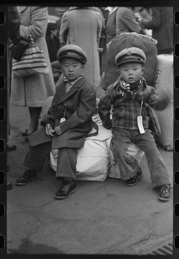 Los Angeles, California. The evacuation of the Japanese-Americans from West Coast areas under U.S. Army war emergency order. Evacuees waiting with their luggage at the old Santa Fe station for a train to take them to Owens Valley