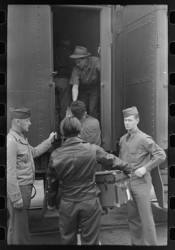 Los Angeles, California. Japanese-American evacuation from West Coast areas under U.S. Army war emergency order. Soldiers supervising the loading of the baggage of Japanese-Americans en route to Owens Valley reception center