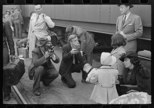 Los Angeles, California. Japanese-American evacuation from West Coast areas under U.S. Army war emergency order. Photographers at the train taking Japanese-Americans to Owens Valley