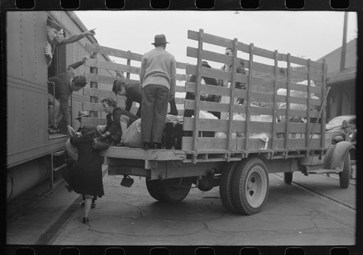 Los Angeles, California. The evacuation of Japanese-Americans from West Coast areas under U.S. Army war emergency order. Loading baggage of Japanese-Americans on train which will take them to Owens Valley
