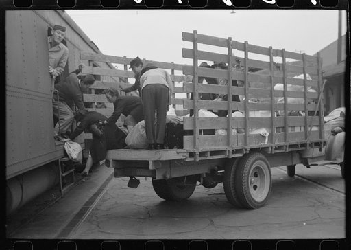 Los Angeles, California. The evacuation of Japanese-Americans from West Coast areas under U.S. Army war emergency order. Loading baggage on train which will take Japanese-Americans from West Coast to Owens Valley