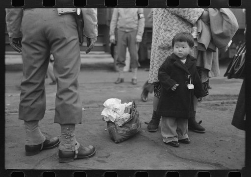 Los Angeles, California. The evacuation of Japanese-Americans from West Coast areas under U.S. Army war emergency order. Japanese-American family waiting for train to take them to Owens Valley