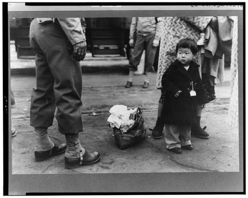 Los Angeles, California. The evacuation of Japanese-Americans from West Coast areas under U.S. Army war emergency order. Japanese-American child who is being evacuated with his parents to Owens Valley