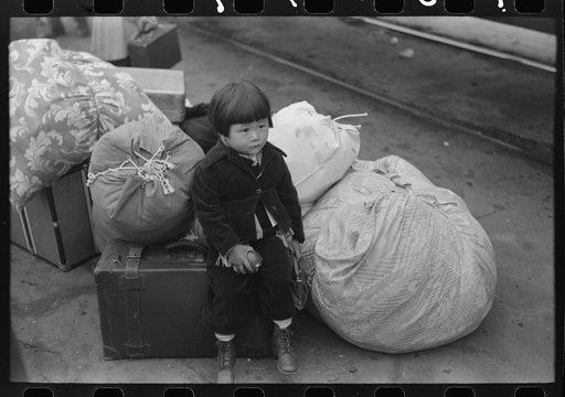 Los Angeles, California. Japanese-American child who is being evacuated with his parents to Owens Valley