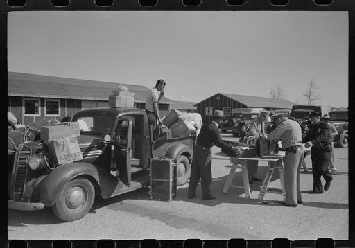Santa Anita reception center, Los Angeles County, California. Baggage of Japanese-Americans being inspected as they arrive from West Coast areas under U.S. Army war emergency order