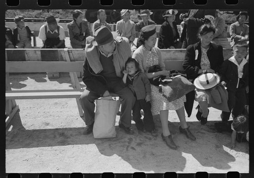 Untitled photo, possibly related to: Santa Anita reception center, Los Angeles, California. The evacuation of Japanese and Japanese-Americans from West Coast areas under U.S. Army war emergency order. Waiting for registration