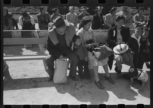 Untitled photo, possibly related to: Santa Anita reception center, Los Angeles, California. The evacuation of Japanese and Japanese-Americans from West Coast areas under U.S. Army war emergency order. Waiting for registration