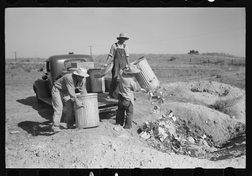 Nyssa, Oregon. FSA (Farm Security Administration) mobile camp. Japanese-Americans dumping garbage. All occupants of the camp spend two hours a week in maintenance work