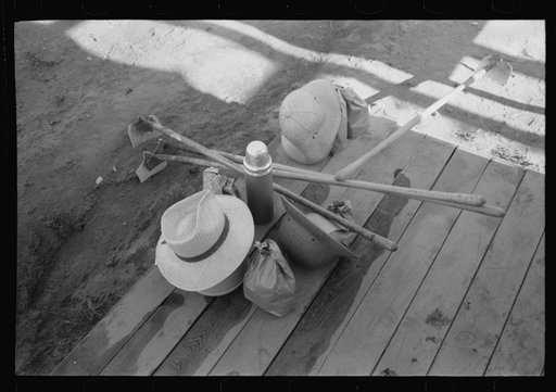 Nyssa, Oregon. FSA (Farm Security Administration) mobile camp. Hoes, lunch bags, and other belongings of Japanese-American farm workers who live at the camp