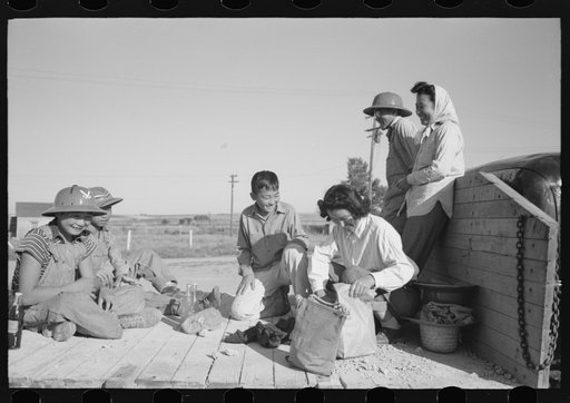 Nyssa, Oregon. FSA (Farm Security Administration) mobile camp. A Japanese-American farm worker's family having lunch