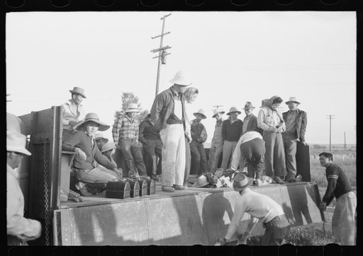 Nyssa, Oregon. FSA (Farm Security Administration) mobile camp. Japanese-American farm workers leaving the camp