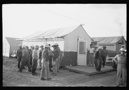 Nyssa, Oregon. FSA (Farm Security Administration) mobile camp. Japanese-American farm workers outside the employment office of the camp