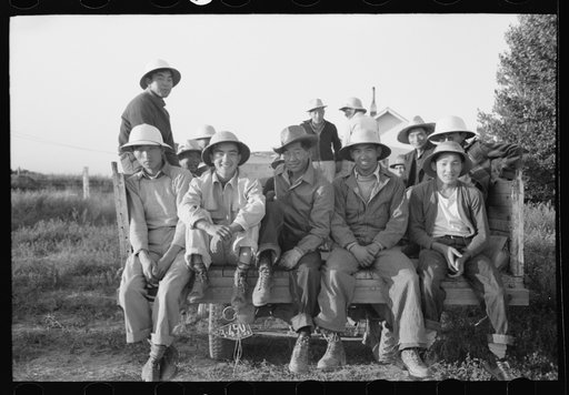 Untitled photo, possibly related to: Nyssa, Oregon. FSA (Farm Security Administration) mobile camp. Japanese-Americans leaving the camp to work in the fields
