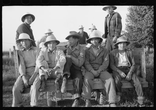 Nyssa, Oregon. FSA (Farm Security Administration) mobile camp. Japanese-Americans leaving the camp to work in the fields