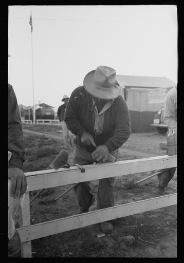Nyssa, Oregon. FSA (Farm Security Administration) mobile camp. Japanese-American farm workers ready to leave for the fields. The farmers send trucks to the camp to pick them up