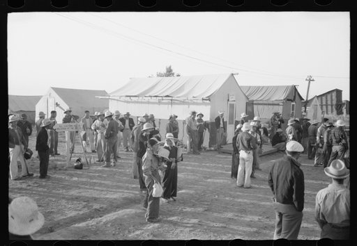 Nyssa, Oregon. FSA (Farm Security Administration) mobile camp. Japanese-American farm workers ready to leave for the fields. The farmers send trucks to the camp to pick them up