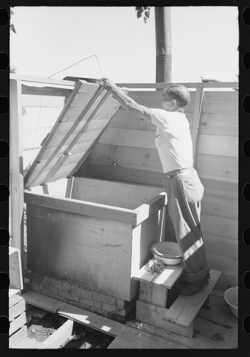 Malheur County, Oregon. Japanese-American who lives with his family on a farm as a tenant and a day laborer, building a Japanese bath