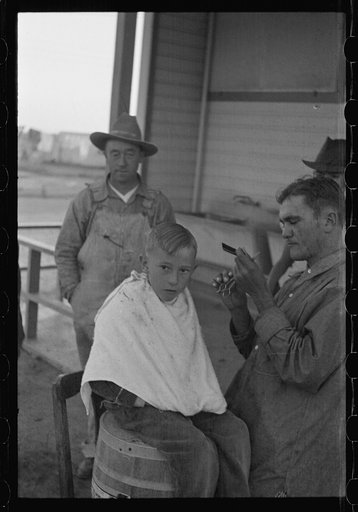 Untitled photo, possibly related to: Community barber shop in Kern County migrant camp, California