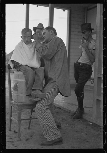 Community barber shop in Kern County migrant camp, California