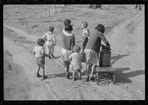 Children of migratory workers, hauling water, American River camp, San Joaquin Valley, California