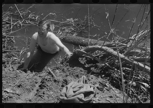 Untitled photo, possibly related to: Rolling logs into river near Littlefork, Minnesota