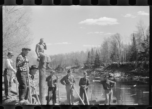 Untitled photo, possibly related to: Rolling logs into river, near Littlefork, Minnesota