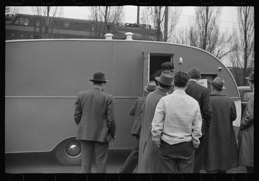 Washington, D.C. A demonstration of FSA (Farm Security Administration) trailers. Bystanders and police escort inspecting a trailer