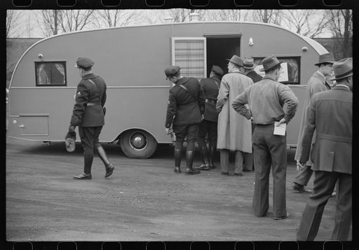 Washington, D.C. A demonstration of FSA (Farm Security Administration) trailers. Bystanders and police escort inspecting a trailer