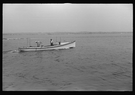 Untitled photo, possibly related to: Eastern shoreman leaving for home after unloading a day's catch of crabs. The boat, the drake type, is the fastest of all work boats. Rock Point, Maryland