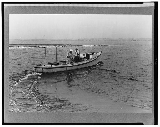 Eastern shoreman leaving for home after unloading a day's catch of crabs. The boat, the drake type, is the fastest of all work boats. Rock Point, Maryland