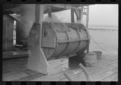 Crab cooker which holds about seven barrels of crabs. The cooking process lasts for thirty minutes and is done by live steam from boiler in background. Rock Point, Maryland