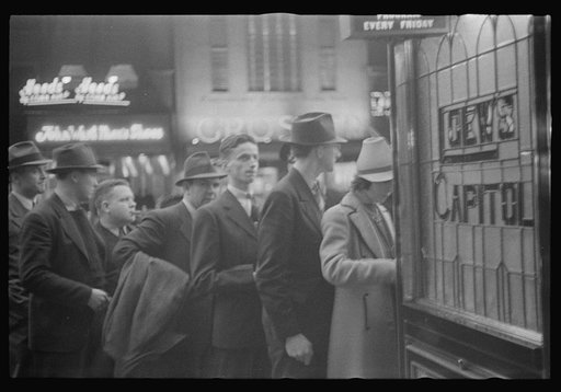 Washington, D.C. A street scene showing people waiting in line for tickets outside Loew's Capitol motion picture theatre
