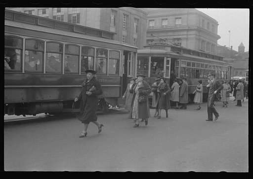 Washington, D.C. A street scene in front of the United States Bureau of Engraving, showing workers boarding street cars on 14th Street