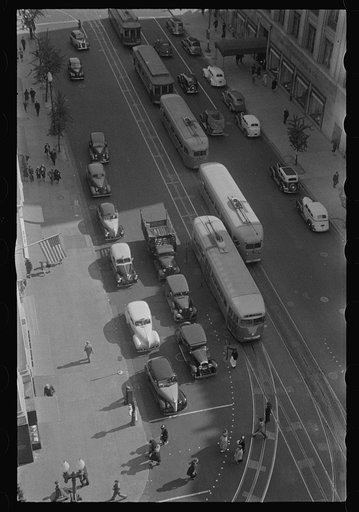 Untitled photo, possibly related to: Washington, D.C. Aerial view of a street corner, in front of the Willard Hotel, at 14th Street and Pennsylvania Avenue showing pedestrians and rather dense traffic in autos and street cars