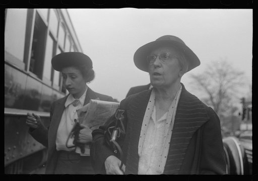 Washington, D.C. Two women, probably government clerks, getting ready to board a street car