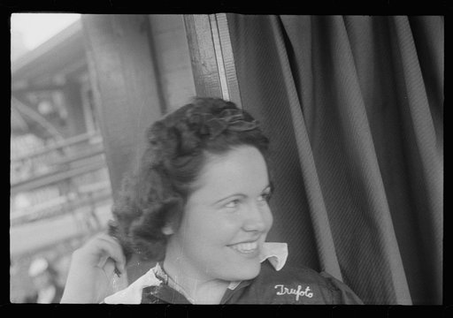 Untitled photo, possibly related to: Washington, D.C. A girl attendant of a ten-cent store photograph booth